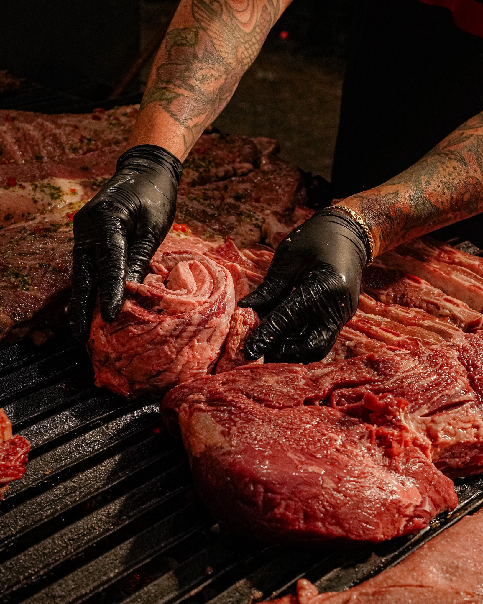 Chef slicing a perfectly grilled ribeye steak